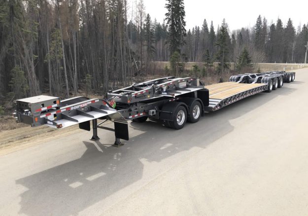 Doepker Trailers Removable Gooseneck double drop flat Doepker Trailers Removable Gooseneck double drop flat sitting on a road