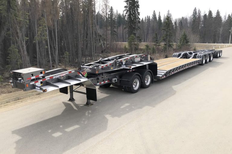 Doepker Trailers Removable Gooseneck double drop flat sitting on a road