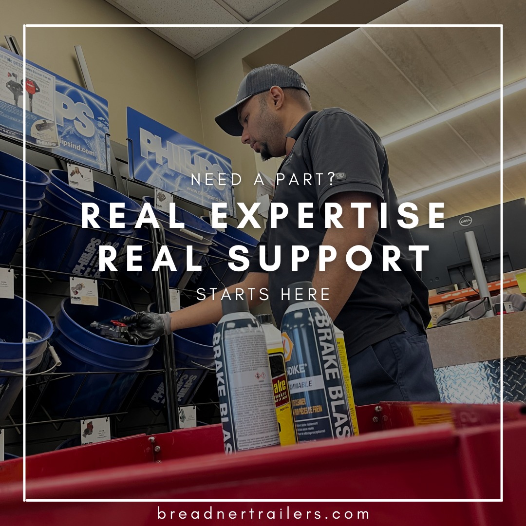 man at Breadner Trailers parts department with cans of brake spray in the forefront of the shot